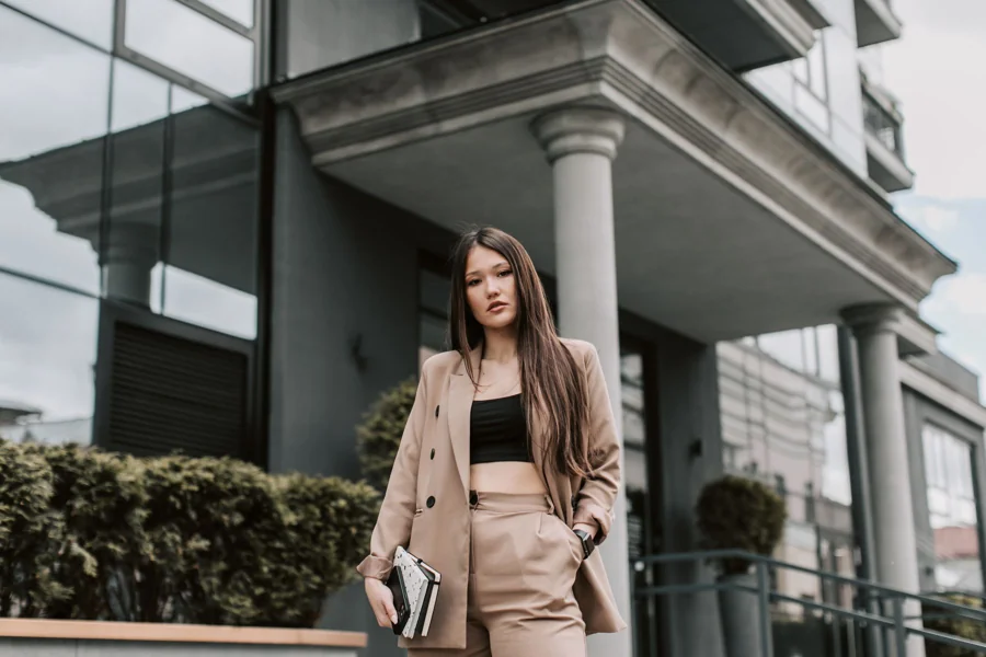 A relaxed sand-coloured jacket and trousers worn outside